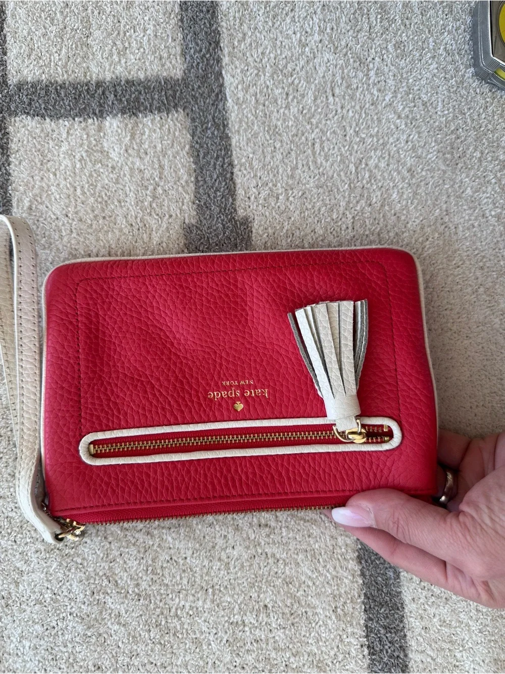 kate spade Red Pebbled Leather Wristlet with Ivory Tassel